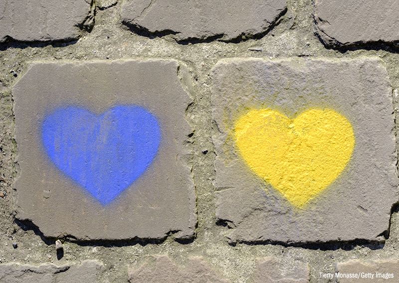 Photo of blue and yellow hearts painted on the street near the Ukraine's mission to the EU in Brussels, 8 March 2022.