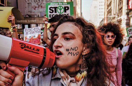 Jamie Margolin at the September 2022 climate strike in New York City.  The #NoMVP on her cheek stands for “No Minnesota Valley Pipeline”