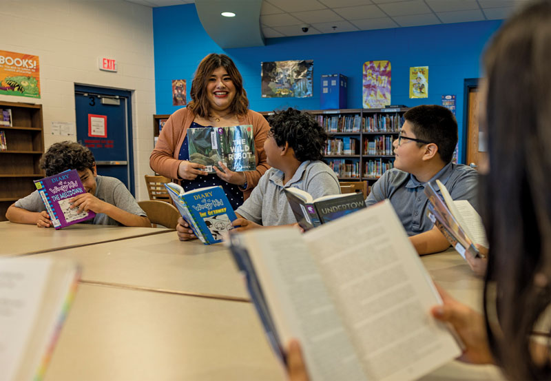 Image of Karina Quilantan-Garza, Library Media Specialist  with students