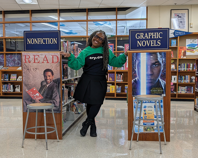 Tatanisha Love, School Librarian of the Year finalist posing in the school library